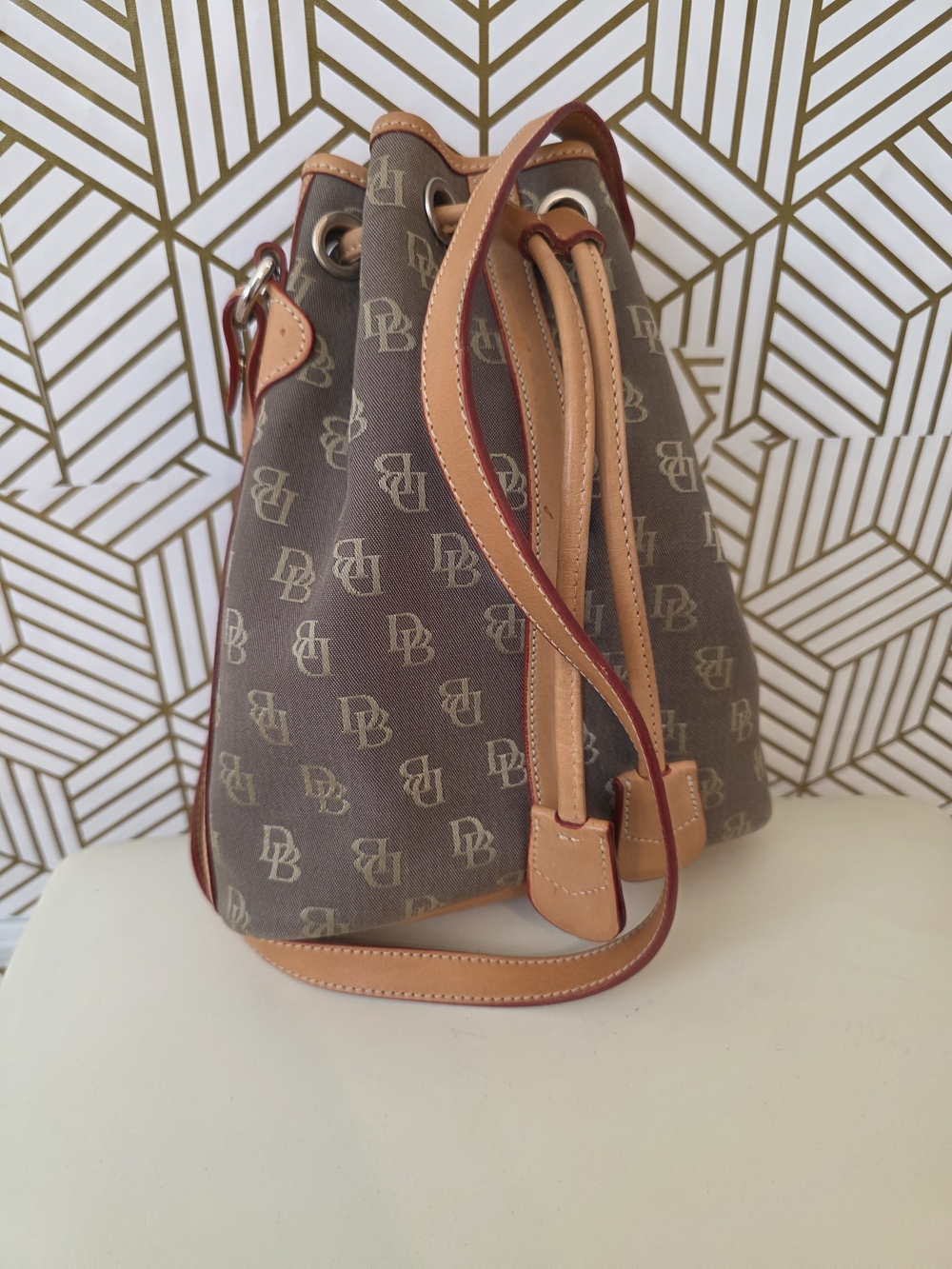 Dooney & Bourke Brown Monogram Drawstring Bucket Bag with Tan Trim